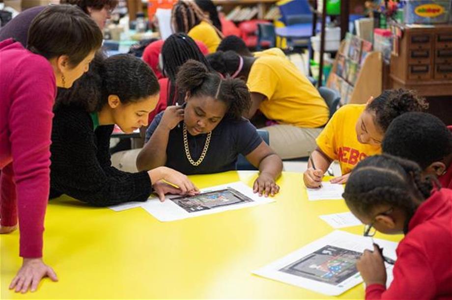 Green Schoolyards 2_1227 Students and teachers at Webster Elementary School in the Lawndale neighborhood review plans for a new schoolyard funded through the Space to Grow initiative. (Courtesy Metropolitan Water Reclamation District of Greater Chicago)