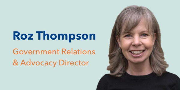 Photo of Roz Thompson, smiling with shoulder-length hair, next to text that reads: ‘Roz Thompson, Government Relations & Advocacy Director’ in blue and orange on a light green background.