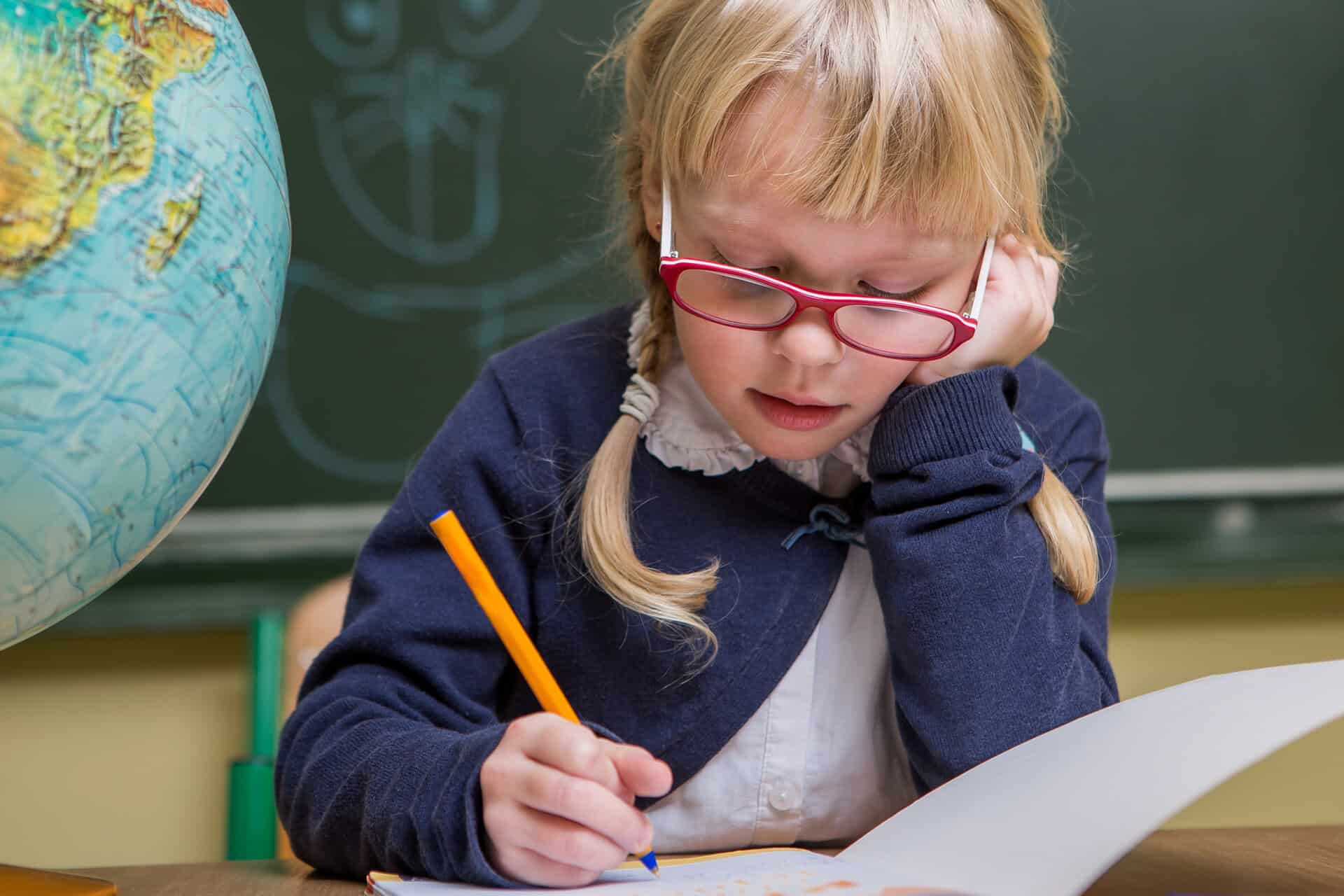 young girl writing a letter