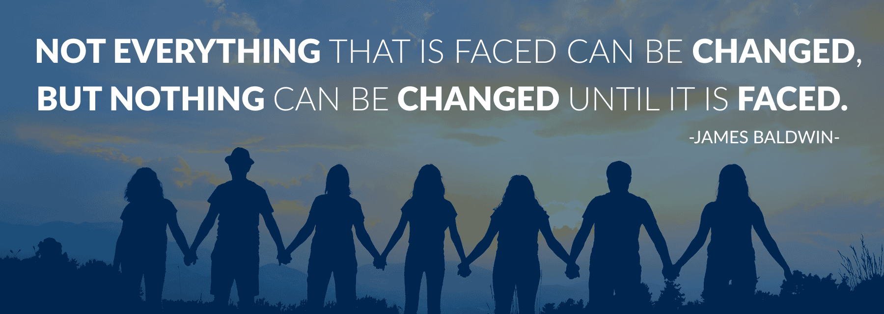 Silhouetted people holding hands at sunset with a James Baldwin quote about change and facing challenges.